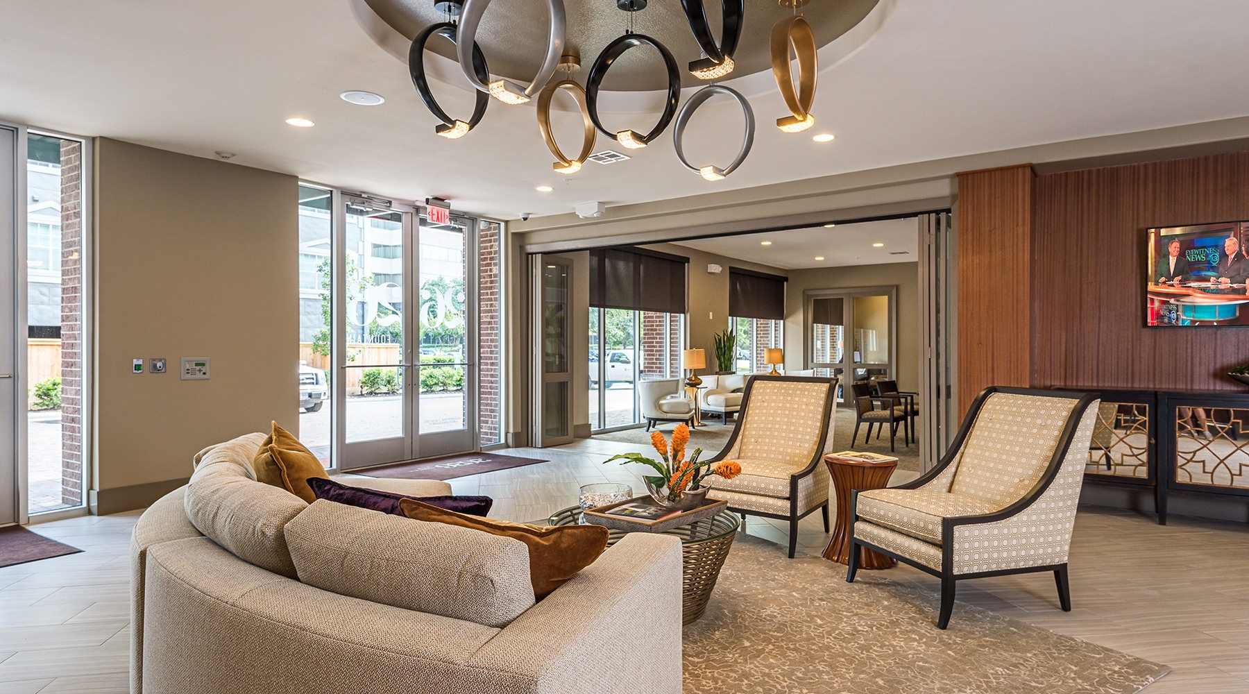 Access to resident only features lounge area with seating and a chandelier