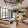 lounge area with seating and a chandelier