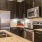 a kitchen with black cabinets