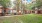 courtyard with grass and a walking path