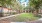 courtyard with grass and a walking path