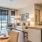 a living room with a large kitchen