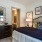 a bedroom with a bed and lamps