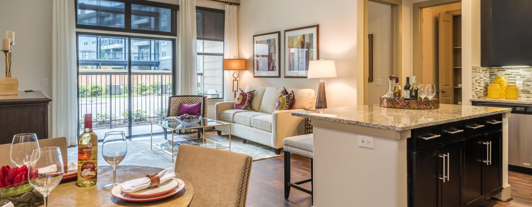 a living room with a large kitchen