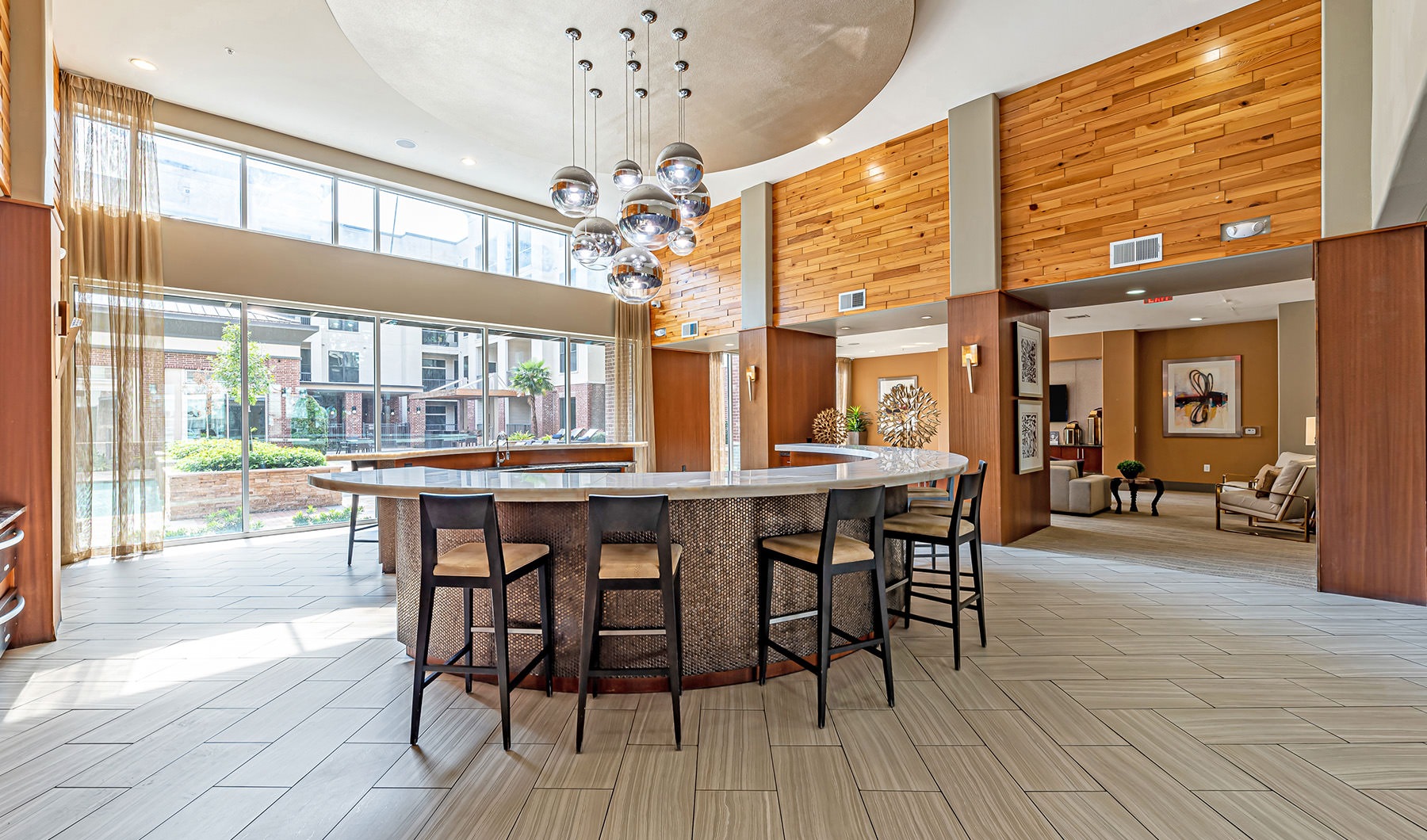 large kitchen with a round table and seating